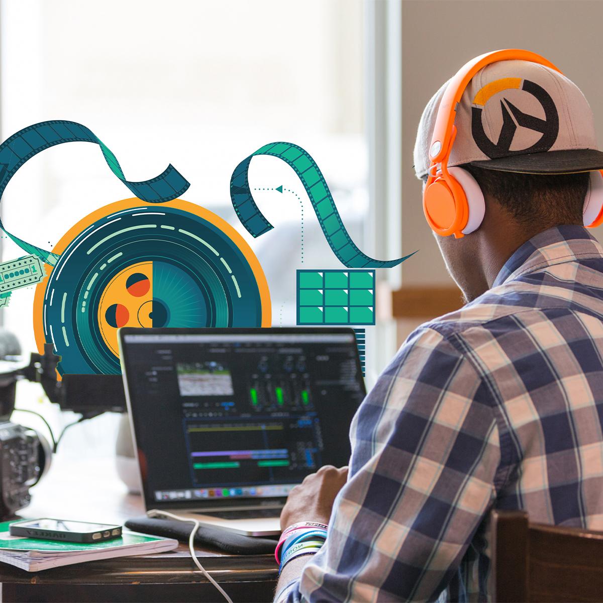 A person wearing headphones, sitting at a table, works on a video project.